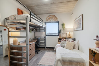 Bedroom with loft bed and large window