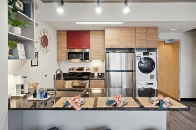 Kitchen with stainless steel appliances and a breakfast bar