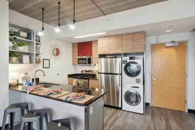 Kitchen with stainless steel appliances and a breakfast bar