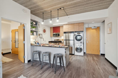 Kitchen with stainless steel appliances and a breakfast bar