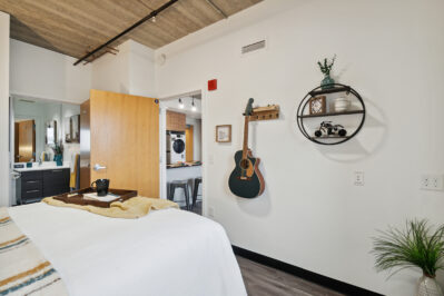 Furnished bedroom with view of the living space