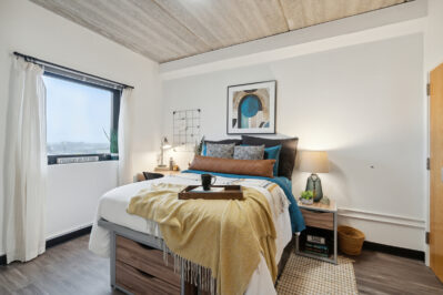 Furnished bedroom with a window