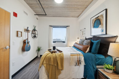 Furnished bedroom with a window