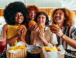 a group of friends enjoying hamburgers